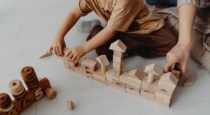 A child playing with building blocks at nursery, an engaging STEM activity