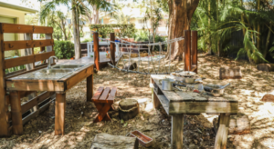 An outdoor play kitchen at a nursery setting where children can be involved with water play activities.